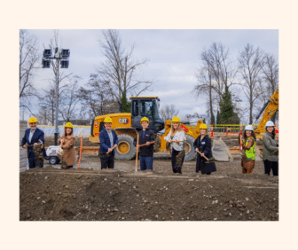 May contain eight people posing with shovels at a groundbreaking ceremony.
