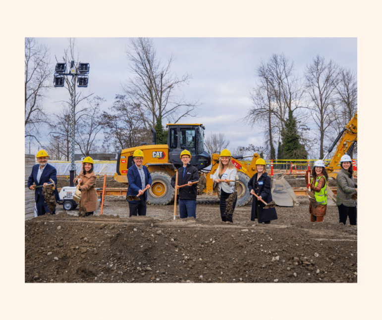 May contain eight people posing with shovels at a groundbreaking ceremony.