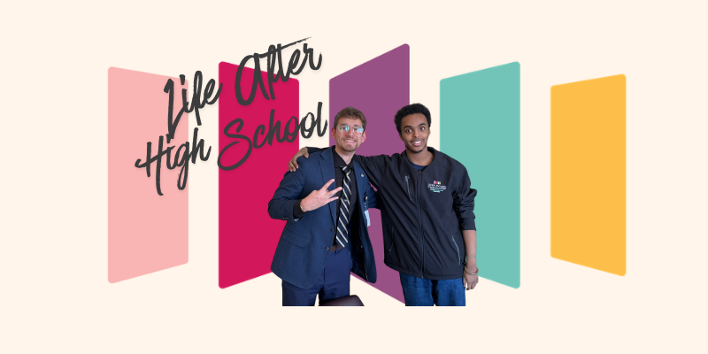 May contain two people, one in a suit, one in a jacket, in front of colorful panels and text.